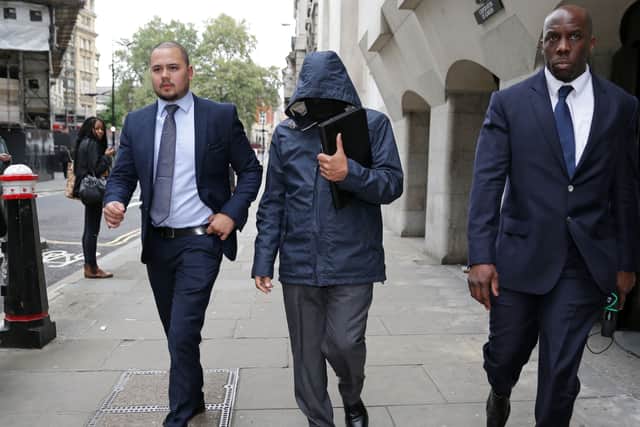 Mazher Mahmood (R), a British journalist known as the Fake Sheikh, is pictured as he leaves the Central Criminal Court in central London, on September 19, 2016. (Photo by DANIEL LEAL/AFP via Getty Images)