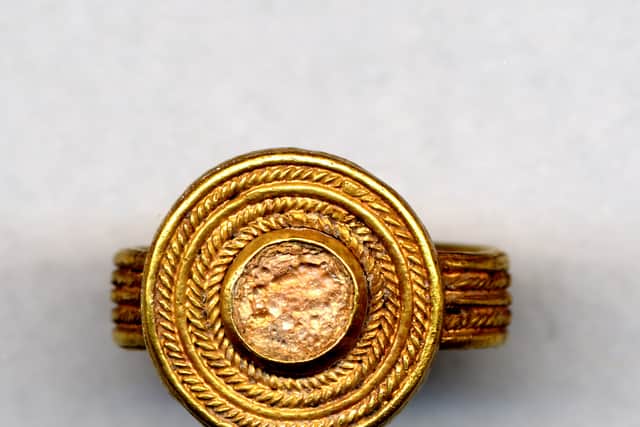 Undated handout photo issued by the British Museum of a gold finger-ring with a glass setting, similar to the items missing from their collections.