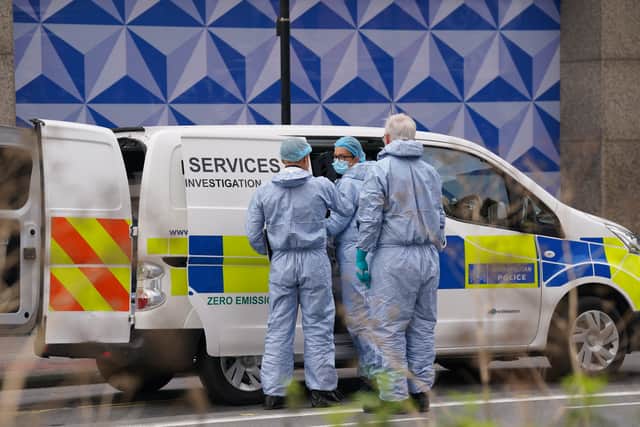 Forensic investigators at the scene near the Whitgift shopping centre in Croydon, south London after a 15-year-old girl was stabbed to death on Wednesday morning.