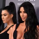 US media personalities Kourney Kardashian (L) and sister Kim Kardashian West arrive to attend the amfAR Gala New York at Cipriani Wall Street in New York City on February 6, 2019. (Photo by ANGELA WEISS / AFP)        (Photo credit should read ANGELA WEISS/AFP via Getty Images)