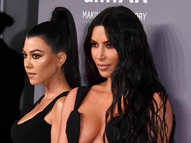 US media personalities Kourney Kardashian (L) and sister Kim Kardashian West arrive to attend the amfAR Gala New York at Cipriani Wall Street in New York City on February 6, 2019. (Photo by ANGELA WEISS / AFP)        (Photo credit should read ANGELA WEISS/AFP via Getty Images)