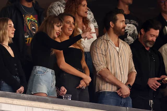 EAST RUTHERFORD, NEW JERSEY - OCTOBER 01: (L-R) Singer Taylor Swift and Actor Ryan Reynolds look on prior to the game between the Kansas City Chiefs and the New York Jets at MetLife Stadium on October 01, 2023 in East Rutherford, New Jersey. (Photo by Dustin Satloff/Getty Images)