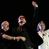EDINBURGH, SCOTLAND - JULY 6:  Midge Ure, Bono and Bob Geldof are seen at the Live 8 Edinburgh concert at Murrayfield Stadium on July 6, 2005 in Edinburgh, Scotland. The free gig, labelled Edinburgh 50,000 - The Final Push, is organised by Midge Ure, alongside Geldof, and coincides with the G8 summit to raisie awareness for MAKEpovertyHISTORY. (Photo by Scott Barbour/Getty Images) 