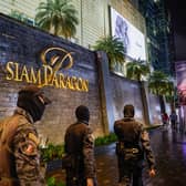 A teenager has been arrested after three people were killed in a shooting at Siam Paragon mall in Bangkok. 