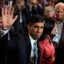 Prime Minister Rishi Sunak waves as he and wife Akshata Murty leave following his speech during the final day of the Conservative Party Conference, during which he announced the scrapping of the Manchester leg of the HS2 rail link (Photo: Christopher Furlong/Getty Images)