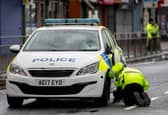 A 16-year-old boy was rushed to hospital after he was struck by a police car in Bolton on Friday morning. 