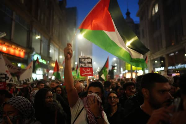 Home Secretary Suella Braverman has told police forces that waving a Palestinian flag in a British street could be deemed as a criminal office if the action is seen as endorsing militant group Hamas following violence in Israel and Gaza. (Credit: Getty Images)