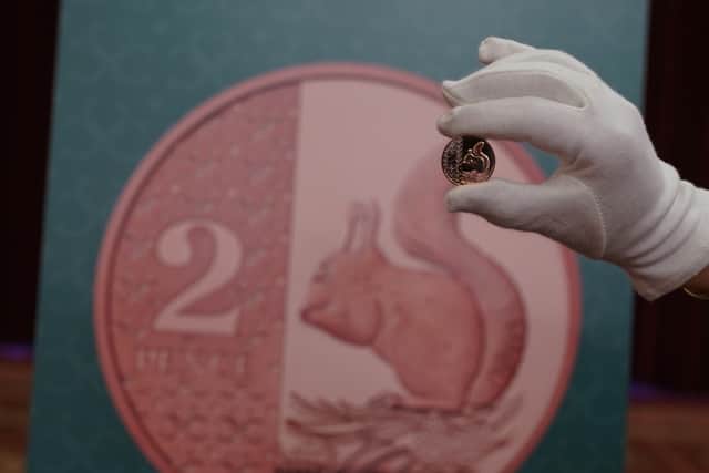 The Royal Mint unveils a two-pence piece, one of eight new coin designs reflecting King Charles III's passion for conservation and the natural world, at Plaisterers' Hall, One London Wall in London. Credit: PA