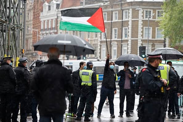 A 22-year-old woman has been arrested on suspicion of supporting proscribed organisation Hamas at a protest.