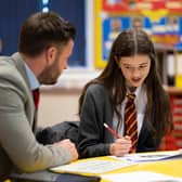 A teacher speaks to a pupil in a classroom at Whitchurch High School on 14 September, 2021 in Cardiff, Wales. Credit: Matthew Horwood/Getty Images