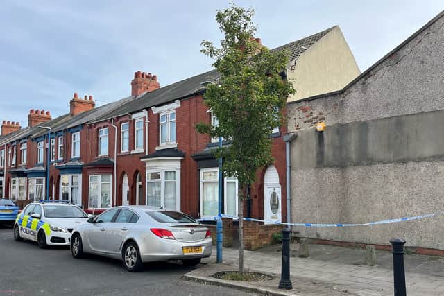 A police cordon at Wharton Terrace, Hartlepool. Cleveland Police were called to a property in the street at 5.17am on Sunday and found an injured man who had suffered non-life-threatening injuries. A second man was found on nearby Tees Street, and he died at the scene.