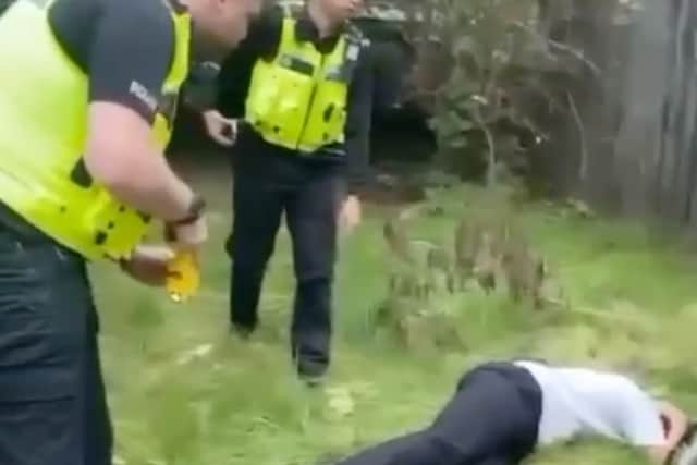 An officer has been referred to a police watchdog after shocking mobile phone footage of a 14-year-old boy being tasered to the ground in a Birmingham suburb.