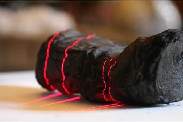 A 3D x-ray was taken of the burned scroll to create a process called 'virtual unwrapping'(Image: University of Kentucky)