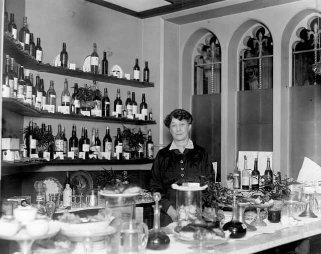 Mrs Tunton behind the bar at the House of Commons in 1919. Credit: Topical Press Agency/Getty Images