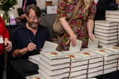 David Mitchell signing copies of his book at the Cheltenham Literature Festival. Picture: Still Moving Media for Cheltenham Festivals