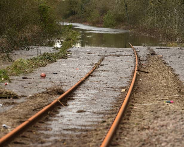 Silt and flood water covers railway train tracks in 2020 after Storm Jorge (Photo: OLI SCARFF/AFP via Getty Images)