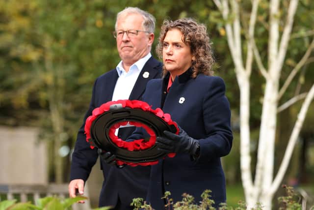 Hannah Ingram-Moore, daughter of Captain Sir Tom Moore and husband Colin pay their respects as they place a wreath on The Burma Star Memorial November 04, 2021 in Alrewas, Staffordshire. (Photo by Charlotte Tattersall/Getty Images)
