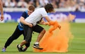 Just Stop Oil protesters Judit Murray, 69, Daniel Knorr, 21, and Jacob Bourne, 27, stopped play during the second Test between England and Australia on June 28 by throwing orange powder paint on the pitch.