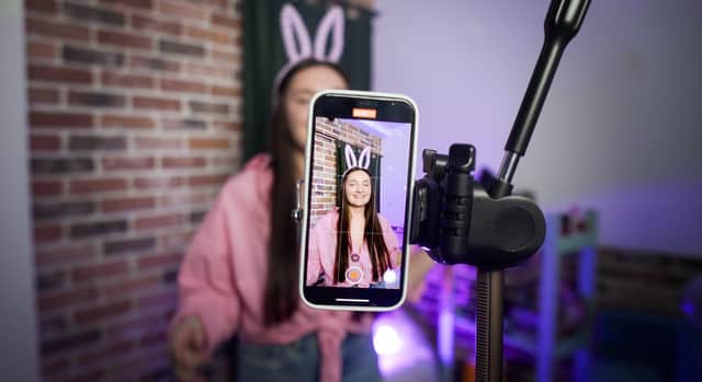TikTok is considering allowing long form 15 minute videos on its platform in a move that is set to rival Youtube. Image by Adobe Photos.