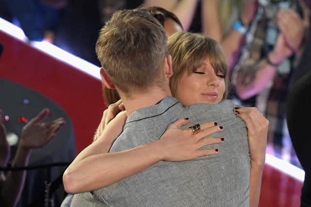 Taylor Swift hugs Calvin Harris at the iHeartRadio Music Awards in April, 2016. Credit: Getty Images
