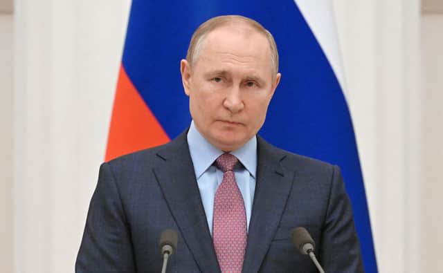 Russian President Vladimir Putin was reportedly "found on the floor" after suffering from a "cardiac arrest", according to a statement posted on social media site Telegram by General SVR. (Credit: Sputnik/AFP via Getty Images)