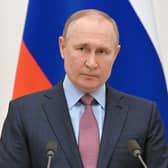 Russian President Vladimir Putin was reportedly "found on the floor" after suffering from a "cardiac arrest", according to a statement posted on social media site Telegram by General SVR. (Credit: Sputnik/AFP via Getty Images)