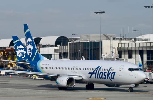 Joseph Emerson, an off-duty pilot sitting in the cockpit’s jump seat, tried to grab the handle of an emergency exit “mid-flight” on an Alaska Airlines jet. (Photo: AFP via Getty Images) 