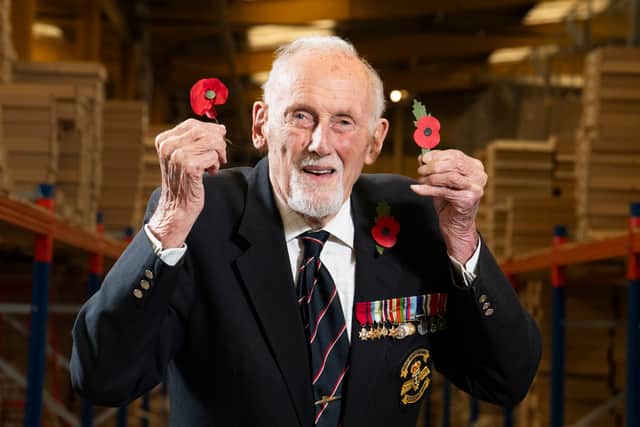 99-year-old D-Day veteran John Roberts, who served in the Royal Navy for 40 years, holding the new plastic-free paper poppy Jordan Pettitt/PA Wire