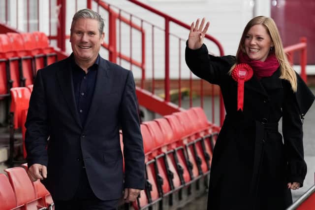 Labour candidate Sarah Edwards waves as she walks next to Labour Party leader Keir Starmer after winning the Tamworth by-election. Credit: Getty