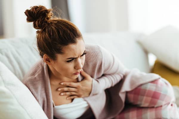 Coughing might not be a sign of flu or Covid-19 - it could mean you have tuberculosis. (Picture: Adobe Stock)