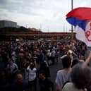 Protesters block main highway bridges as they take part in a rally to call for the resignation of top officials and curtailing violence in the media, a month and half after two back-to-back shootings that killed 18 people, in Belgrade on June 17, 2023 (Photo by Oliver Bunic / AFP) 