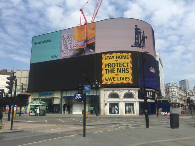 Lee Cain's slogan of 'stay home, protect the NHS, save lives' in an empty Piccadilly Circus during the Covid pandemic. Credit: Ralph Blackburn