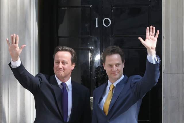 Prime Minister David Cameron greets Deputy Prime Minister Nick Clegg at the door of No. 10 Downing Street on May 12, 2010 in London, England.  (Matt Cardy/Getty Images)