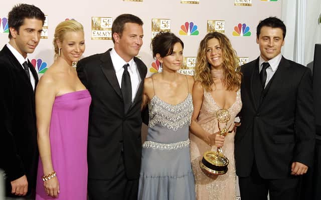 The Friends cast in 2002. From L to R are David Schwimmer, Lisa Kudrow, Mathew Perry, Courteney Cox Arquette, Jennifer Aniston and Matt LeBlanc. Photo by LEE CELANO/AFP via Getty Images.