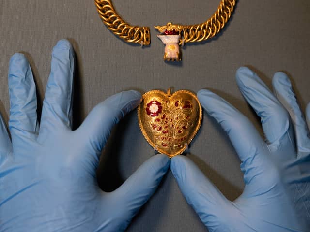 A gold pendant is displayed during a photocall at The British Museum in January, 2023. The heart shaped pendant was found by a metal detectorist in Warwickshire (Dan Kitwood/Getty Images)