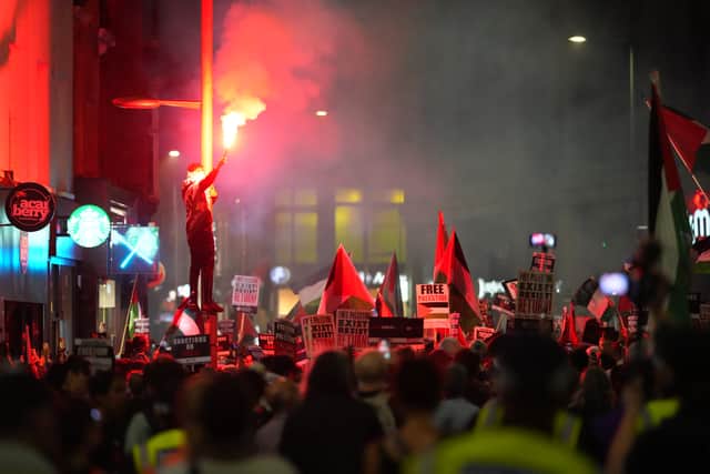 Police arrested 29 protestors at a pro-Palestine march in London after fireworks were fired at officers leaving four injured. (Photo: Getty Images) 