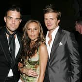 Did Robbie Williams 'date' any other Spice Girls aside from Geri Halliwell? Here he is here with Victoria and David Beckham in 2005. Photograph by Getty