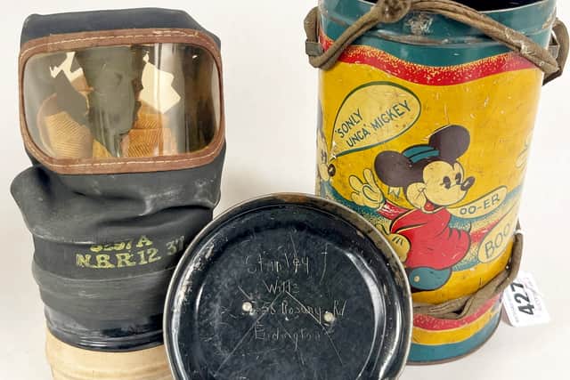WW2 Mickey Mouse tinplate gas mask case (RichardWintertonAuctioneers/SWNS)