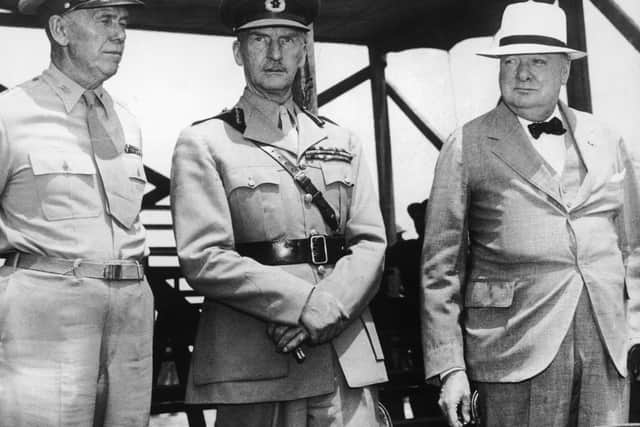 From left to right, General George Marshall (1880 - 1959), British Commander Sir John Dill (1881 - 1944) and British Prime Minister Winston Churchill (1874 - 1965) attend a military demonstration by the 1st Army Corps, 1st July 1942. (Photo by Keystone/Hulton Archive/Getty Images)