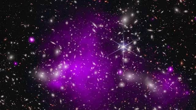The galaxy cluster Abell 2744, with the distant galaxy UHZ1 that formed just 470 million years after the Big Bang. (Image credit: X-ray: NASA/CXC/SAO/Ákos Bogdán; Infrared: NASA/ESA/CSA/STScI; Image Processing: NASA/CXC/SAO/L. Frattare and K. Arcand.)
