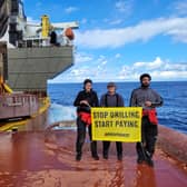 Activists with banner during the  occupation of the Shell oil platform (Photo: Greenpeace/Supplied)
