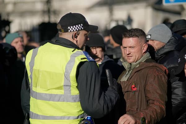 Tommy Robinson speaks to police officers as he arrives at the Cenotaph in Whitehall, central London, ahead of a pro-Palestinian protest march. Jeff Moore/PA Wire