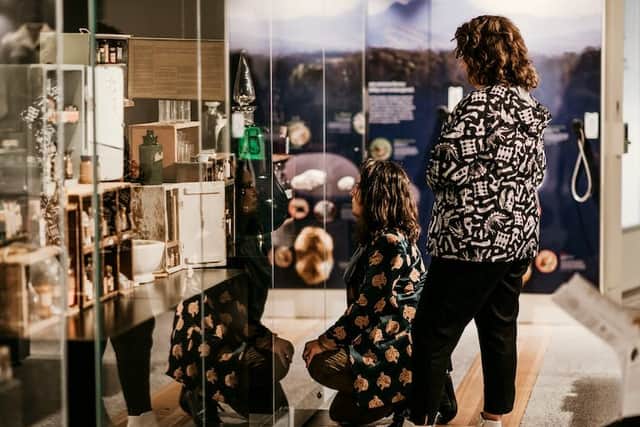 A couple check out some of the items housed at the Tweed Regional Museum in Murwillumbah (Credit: TravelNSW.com)