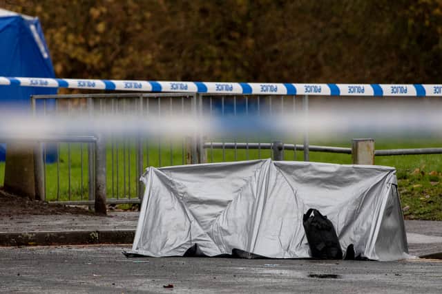 Police at the scene, where a teenager was stabbed to death in Bilston, Wolverhampton.  Anita Maric / SWNS