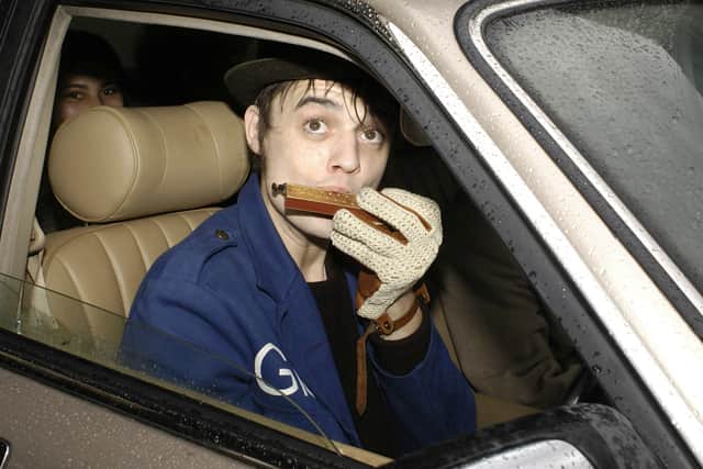Doherty leaves Thames Magistrate's Court in east London playing the harmonica in 2006, after facing charges of drugs possession (Photo: ANDREW STUART/AFP via Getty Images)