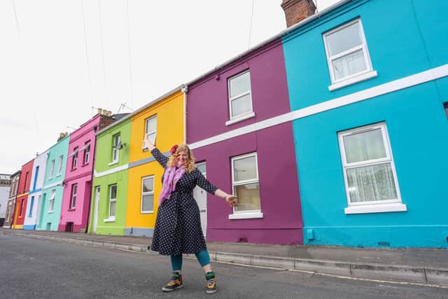 Tash Frootko in front of her latest street to be given a splash of colour (Tom Wren SWNS)