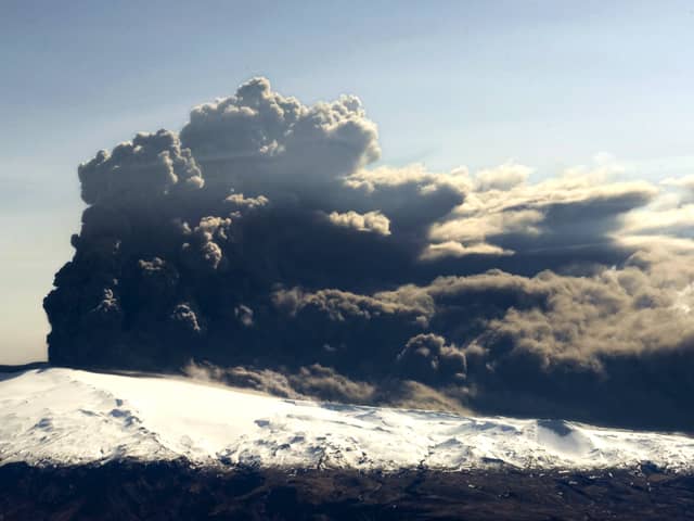 This aerial photo shows the Eyjafjallajökull volcano billowing smoke and ash on April 17, 2010 (HALLDOR KOLBEINS/AFP via Getty Images)