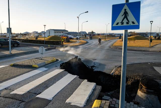 A crack cutting across the main road in Grindavik, southwestern Iceland following earthquakes (Photo: KJARTAN TORBJOERNSSON/AFP via Getty Images)