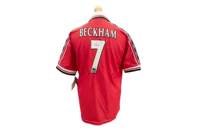 A 1999 Manchester United short-sleeved home shirt with 'Beckham 7' on the back sold for £250