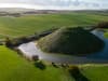 Heavy rainfall in Wiltshire creates moat around 4,000-year-old man-made hill seen in stunning images